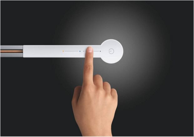 Person using the slide-touch controls on top of light