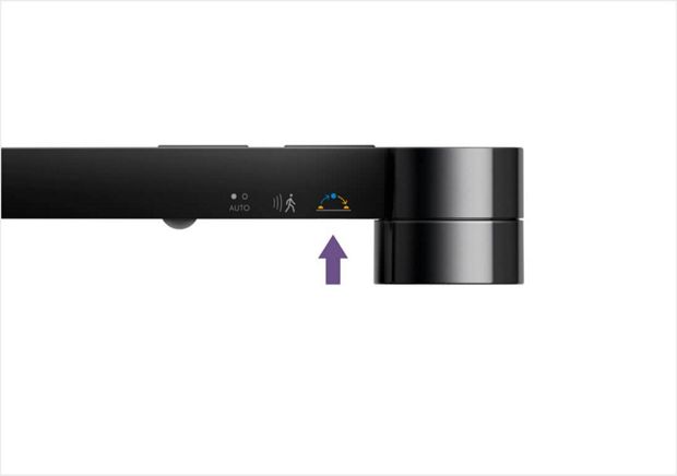 Button closest to optical head that sets light to adjust with daylight 