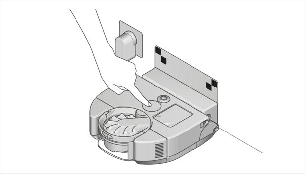 Ilustracja przedstawiająca robota w stacji ładującej