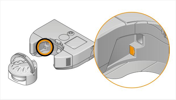 Ilustracja przedstawiająca robota z wyjętym pojemnikiem na zanieczyszczenia