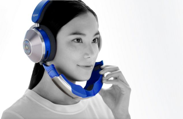 Woman wearing the Dyson Zone headphones in a gym.