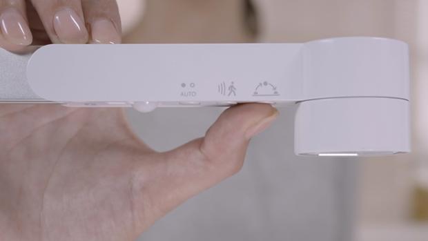 Close up of the auto-brightness button