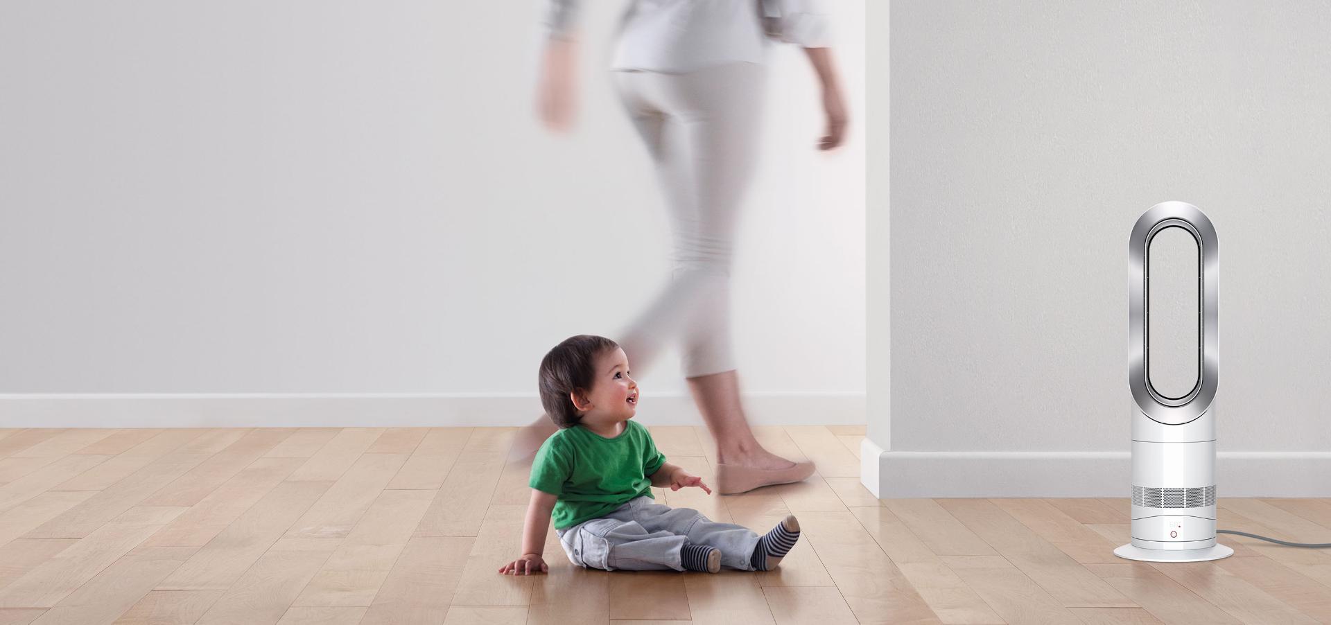 Child with Dyson fan heater