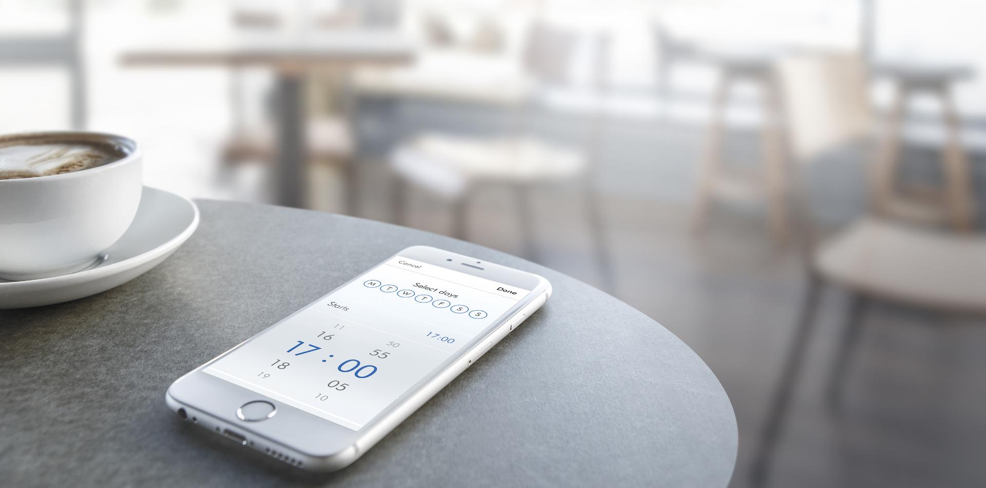 Smartphone with Dyson Link app on table