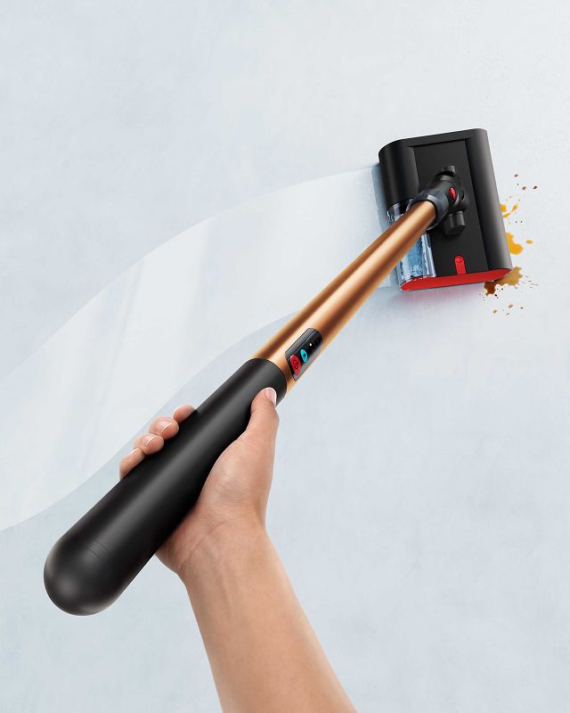 A person effortlessly cleans with the Dyson PencilWash hard floor cleaner.