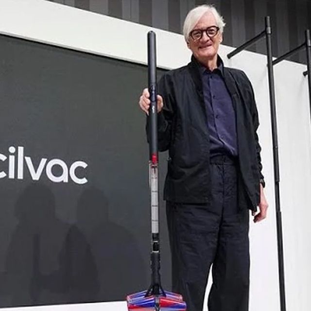 Sir James Dyson unveils the Dyson PencilVac cordless vacuum at an event.