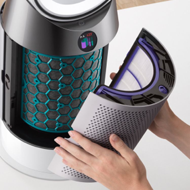 A close-up of hands removing the outer filter from the Dyson Purifier Cool Formaldehyde purifier