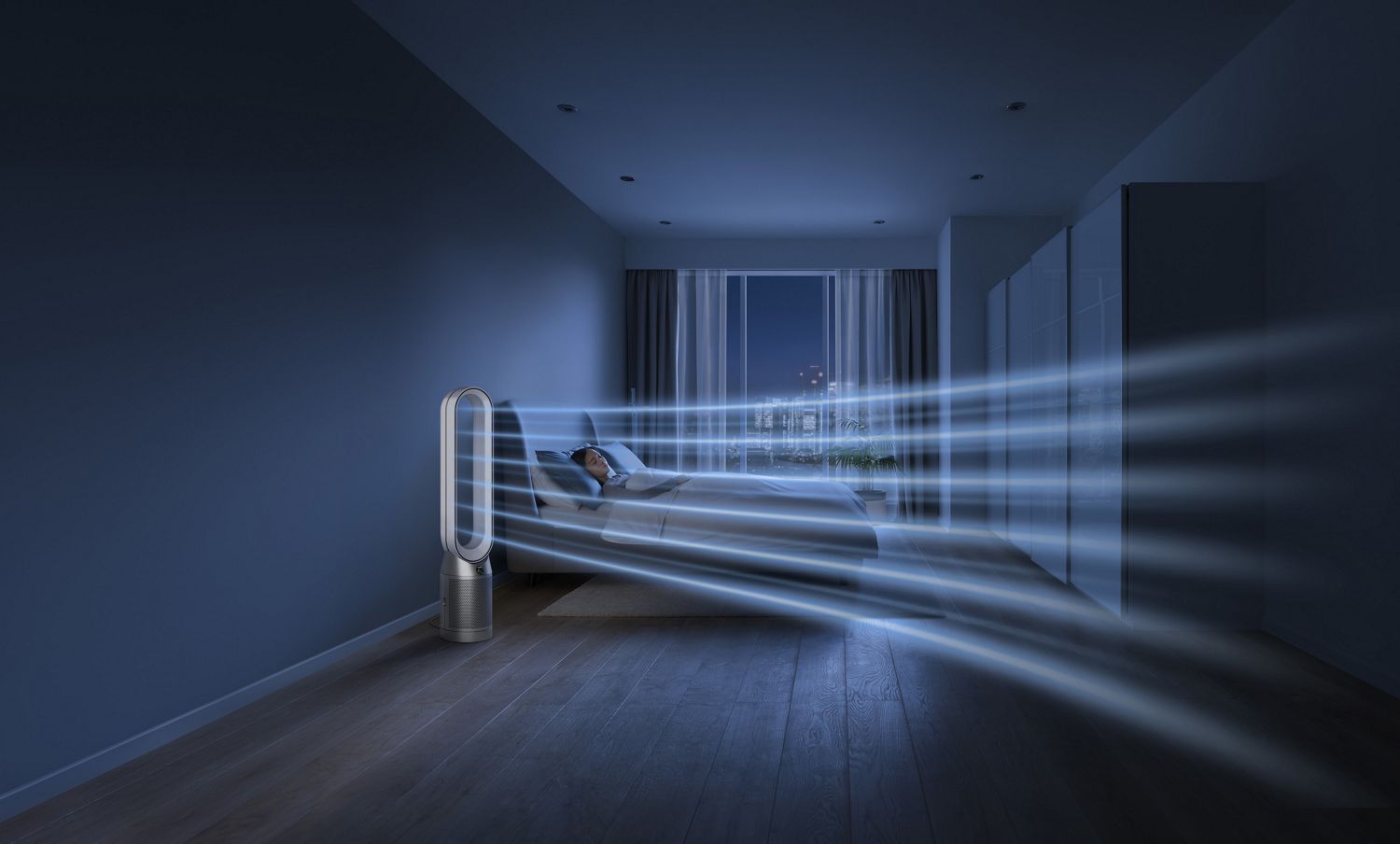 Dyson purifier in a dark bedroom with someone sleeping peacefully