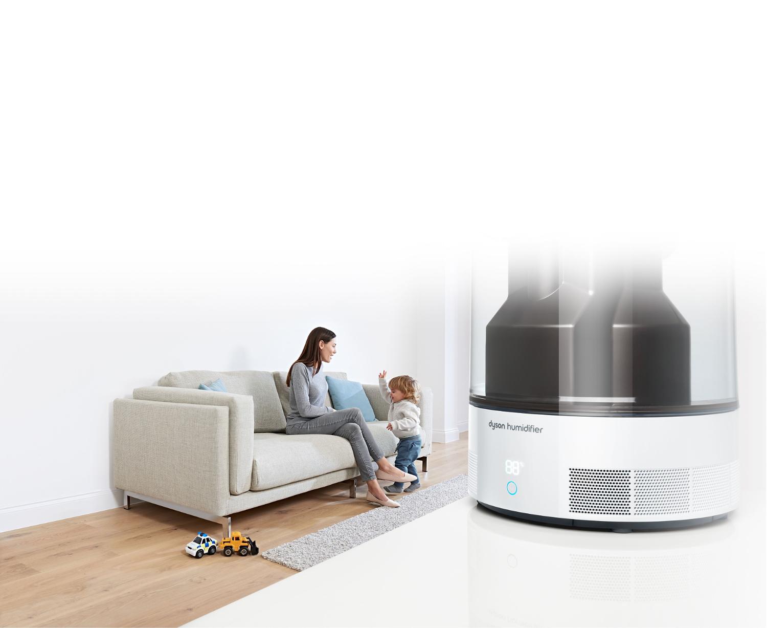 Dyson humidifer close up with mother and child in background