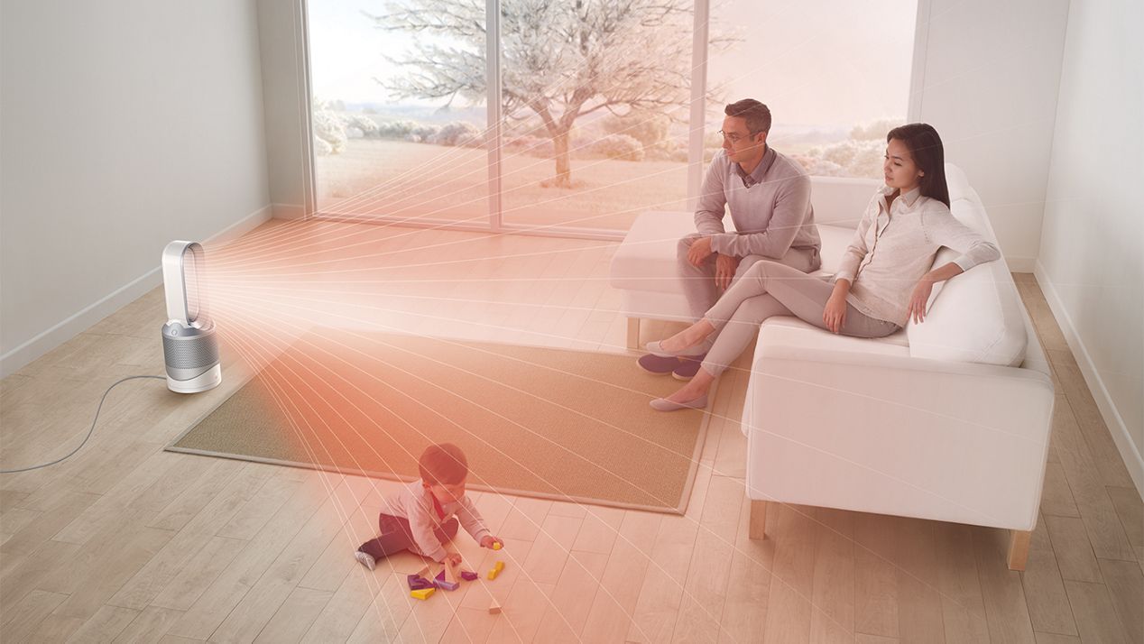 Family in living room with Dyson Pure+Cool purifier fan heater