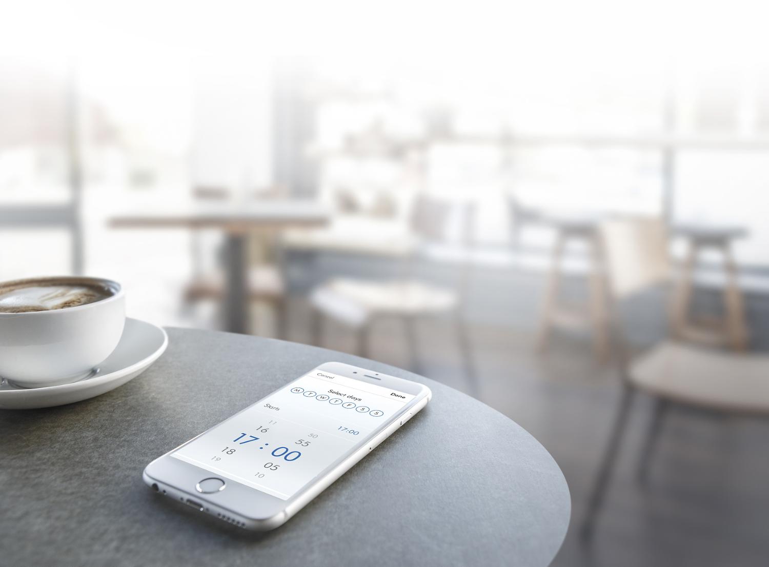 Smartphone with Dyson Link app on table