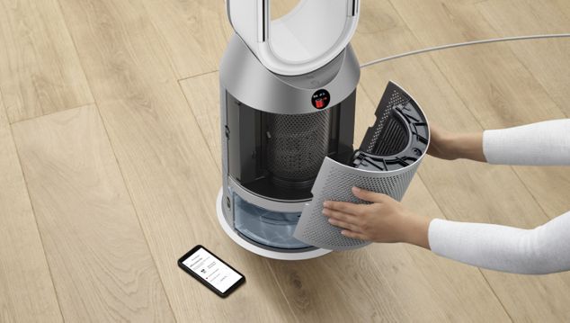 Woman removing filter from the Dyson purifier humidifier