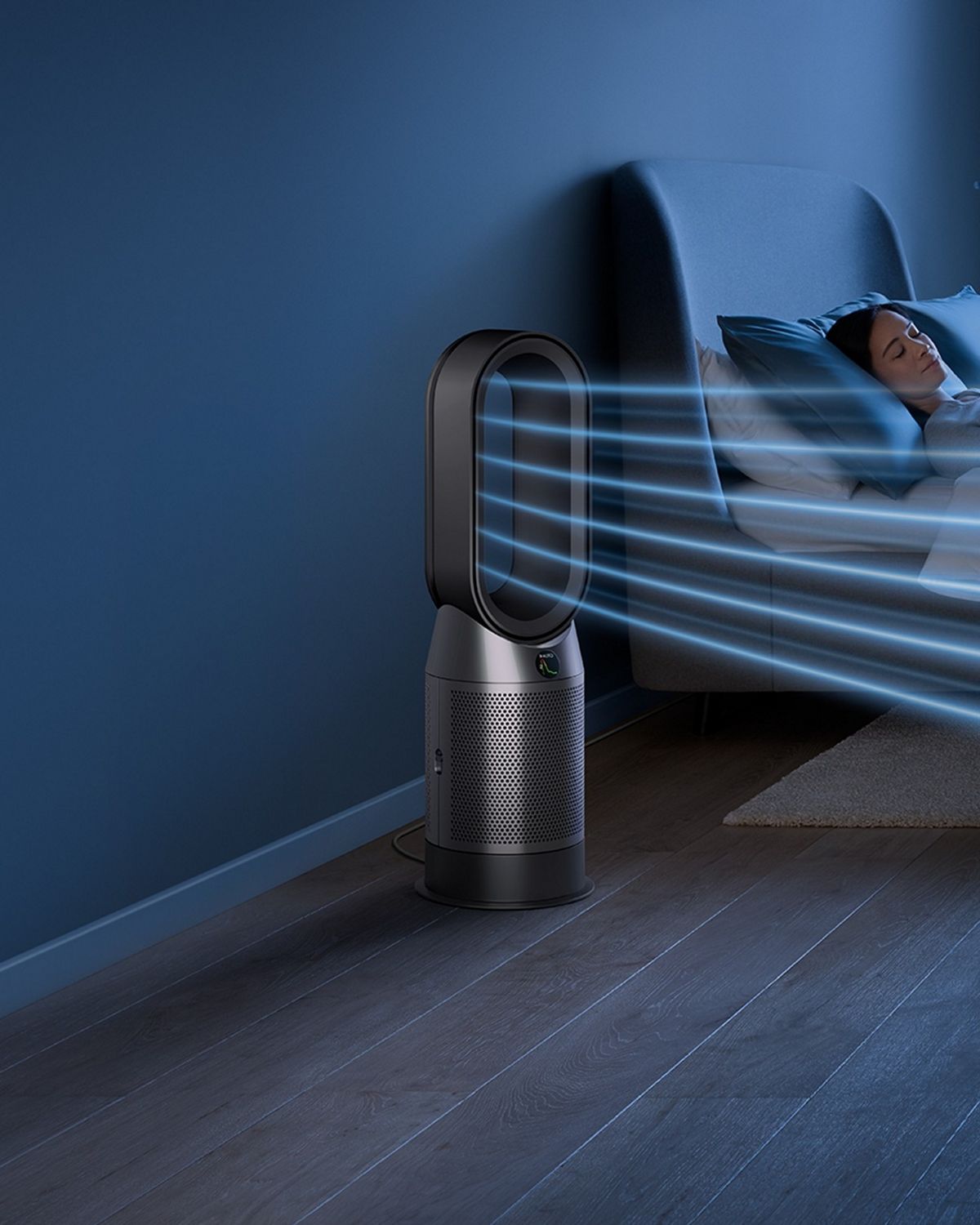 The Dyson Purifier Hot+Cool HP1 heating purifier operating in Night mode next to a sleeping person.