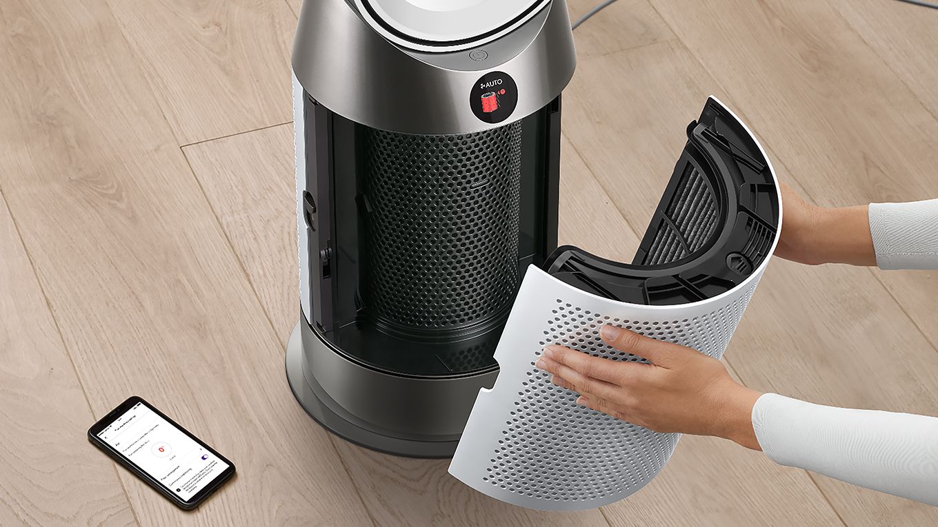 A Dyson Purifier Hot+Cool HP1 has its filter replaced.