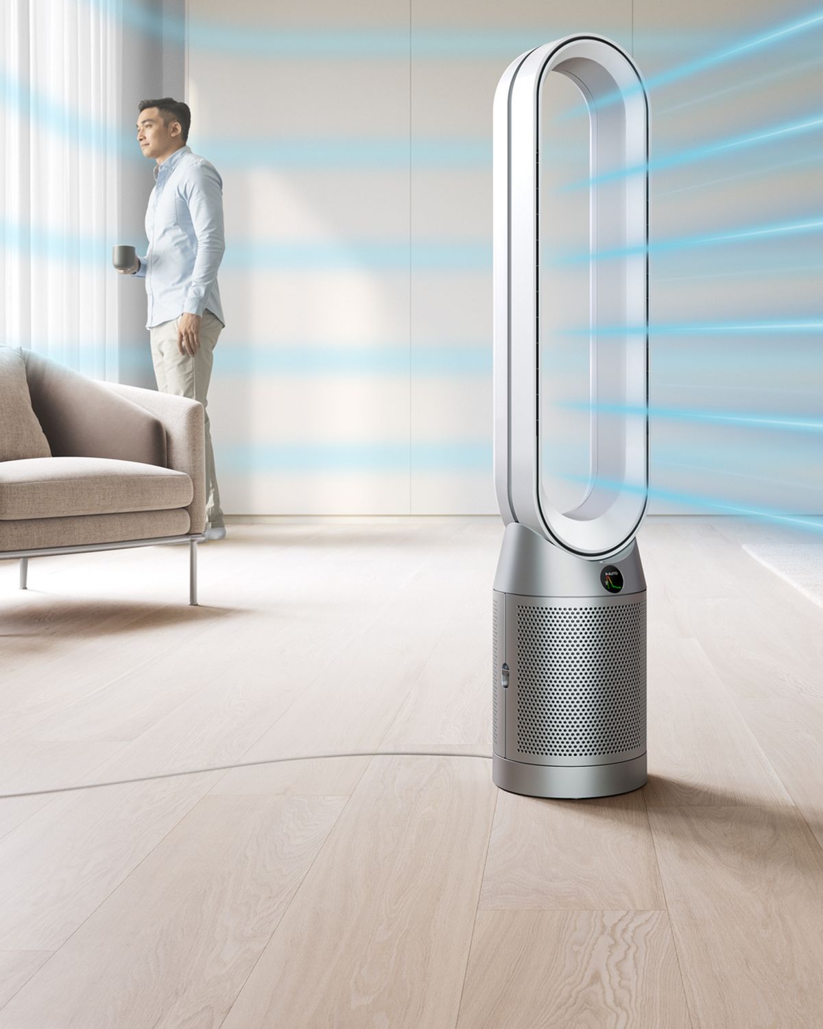 The Dyson Purifier Cool PC1 air purifier delivering a cool breeze with purified air in a large room.