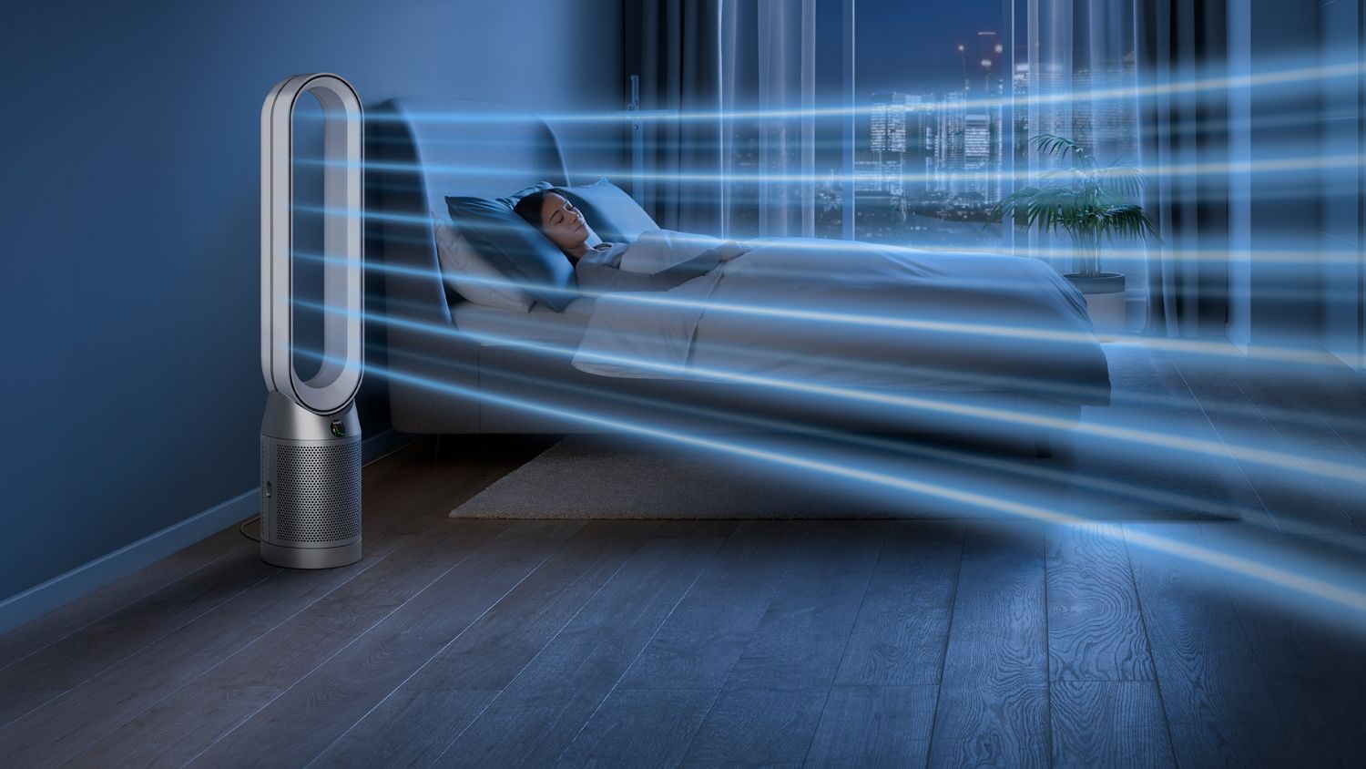The Dyson Purifier Cool PC1 air purifier operating in Night mode next to a sleeping person.