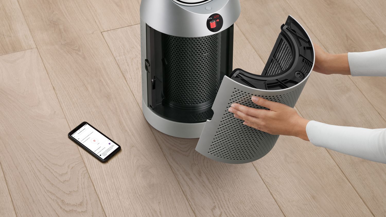 The Dyson Purifier Cool PC1 air purifier filter being removed.