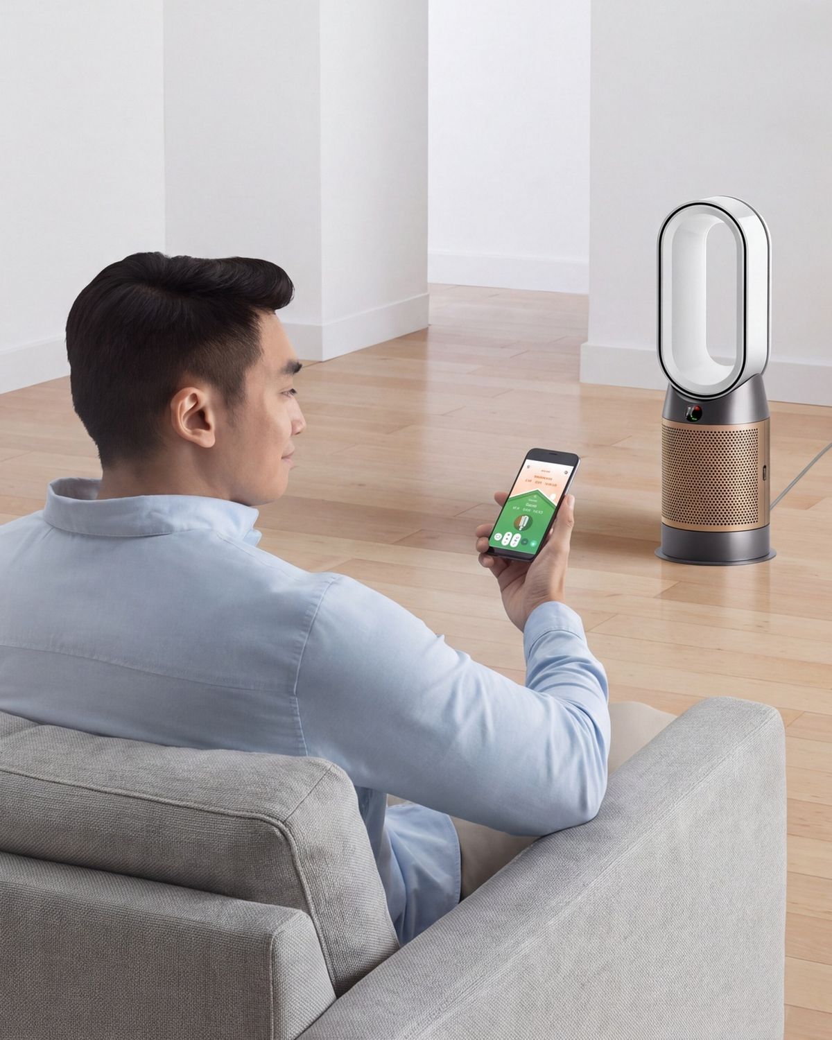 Person operating a purifier using the MyDyson app on a mobile device.