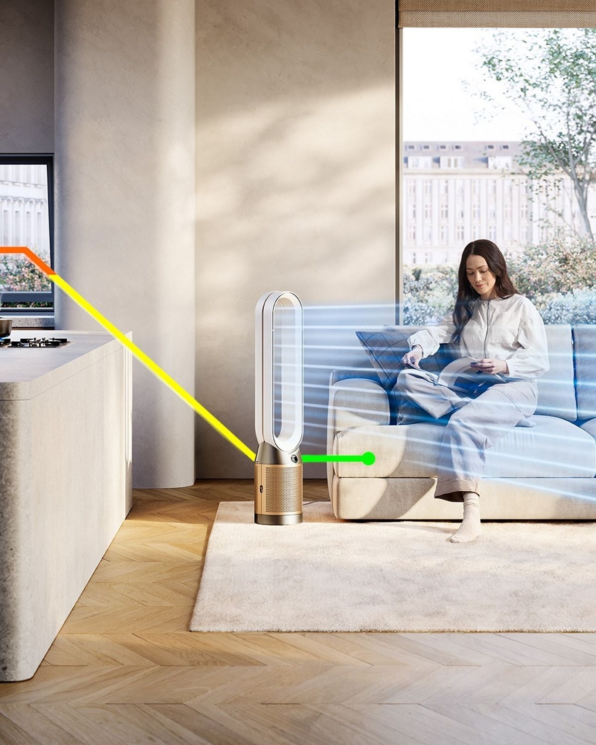 A living space with a person cooking and a person sitting on a sofa reading. A Dyson purifier is purifying the air.