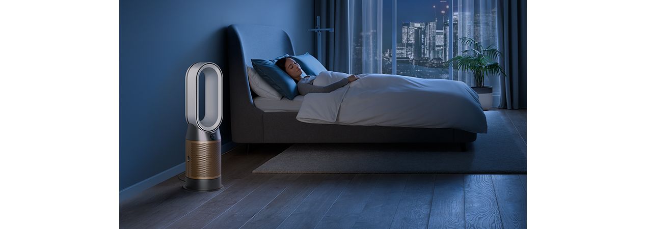 Dyson HP09 purifier heater in a dark bedroom with someone sleeping peacefully
