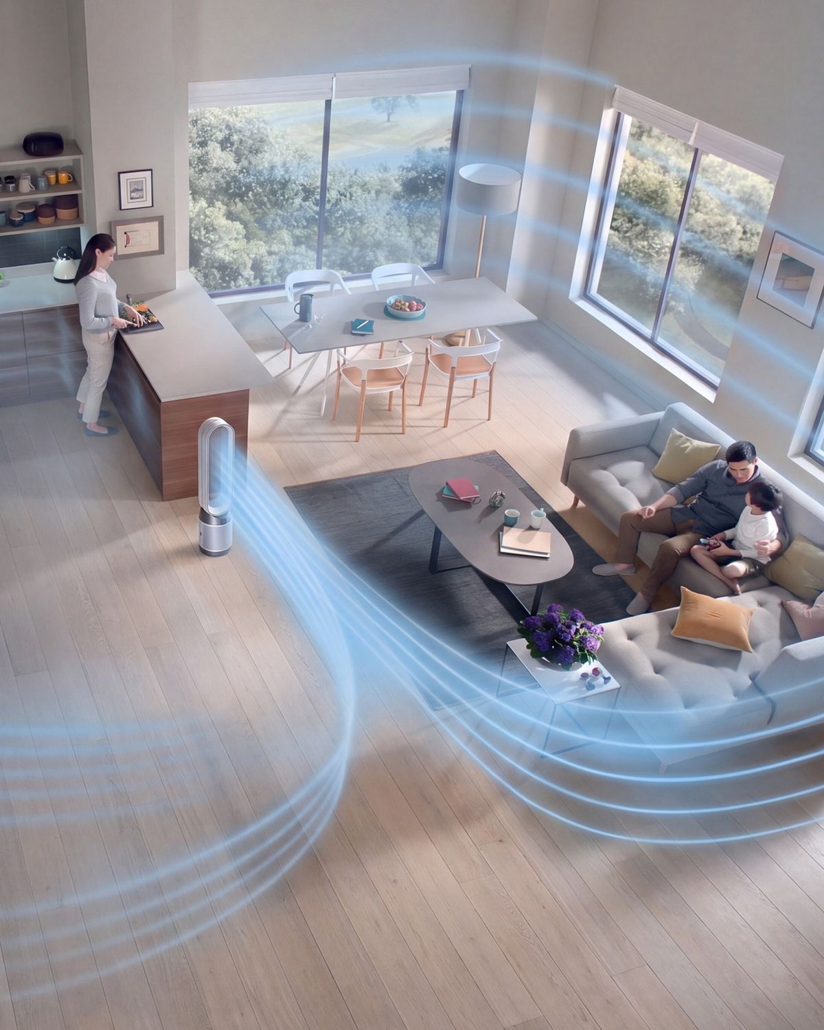 The Dyson Pure Cool purifier fan in the center of a family living room, while a child plays.The blue streams emanating from its loop show the projection of purified air around the room. 