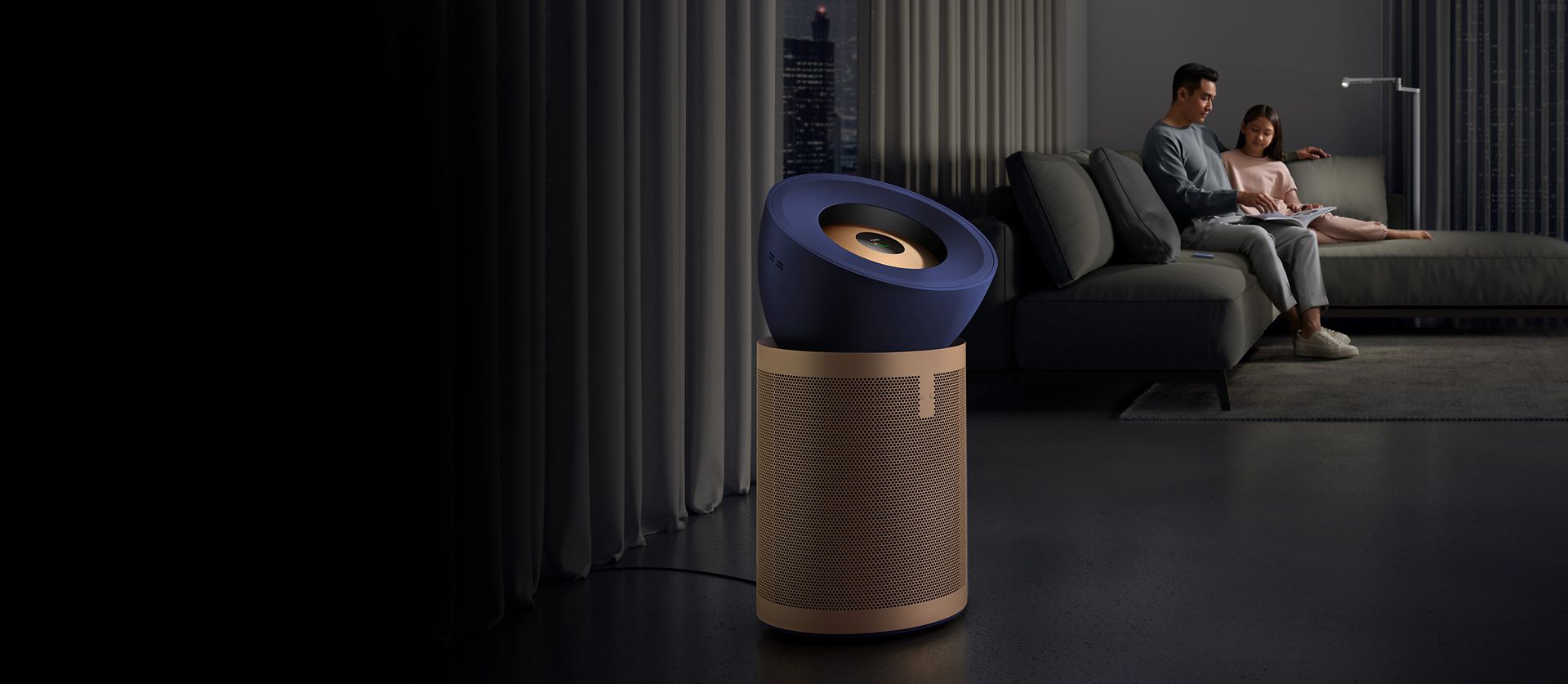 Dyson Purifier Big+Quiet Formaldehyde in a living room next to a sofa where a father and daughter are reading.