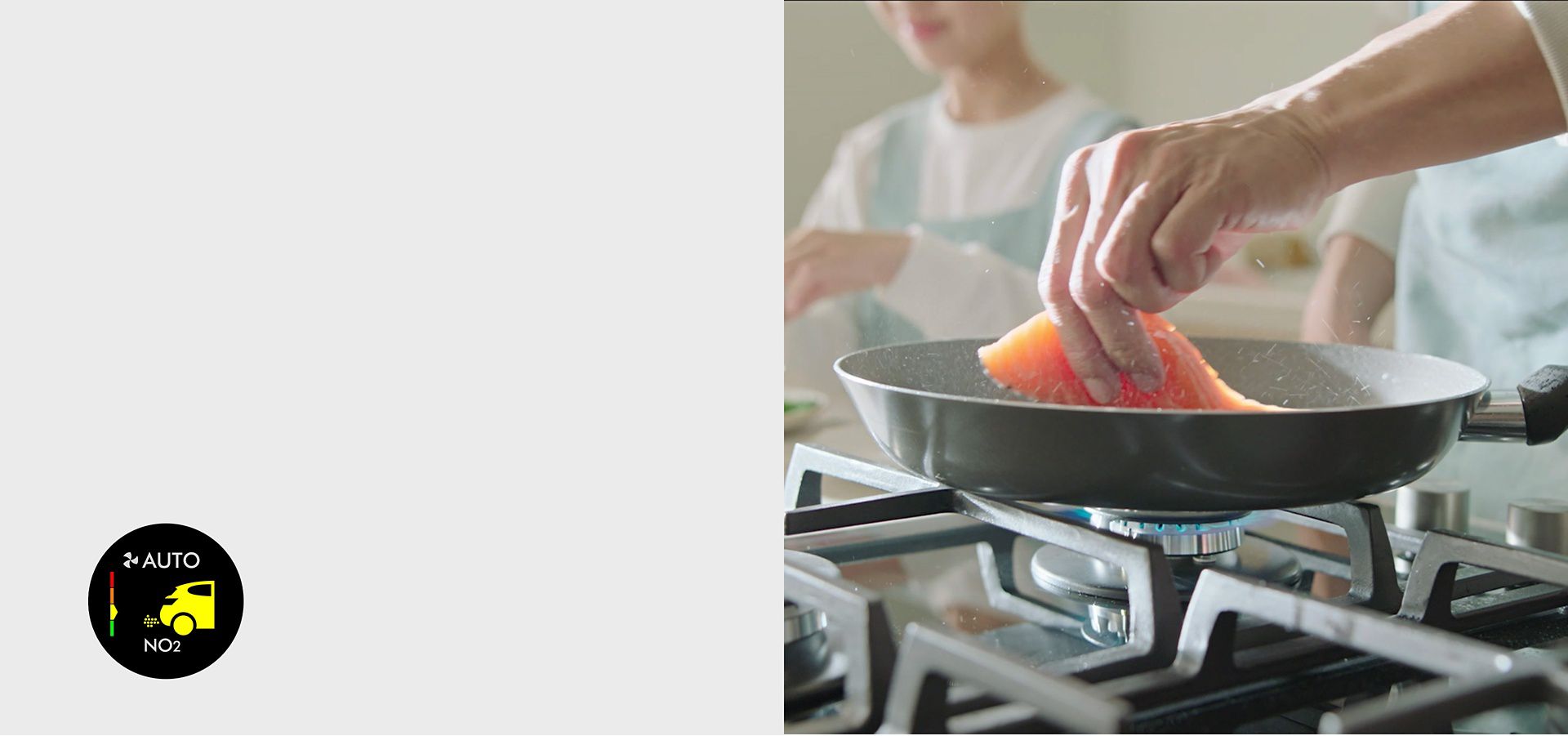 Close-up of a pan on a gas stove cooking fish. A graphic from the purifer's screen shows nitrogen dioxide is present.