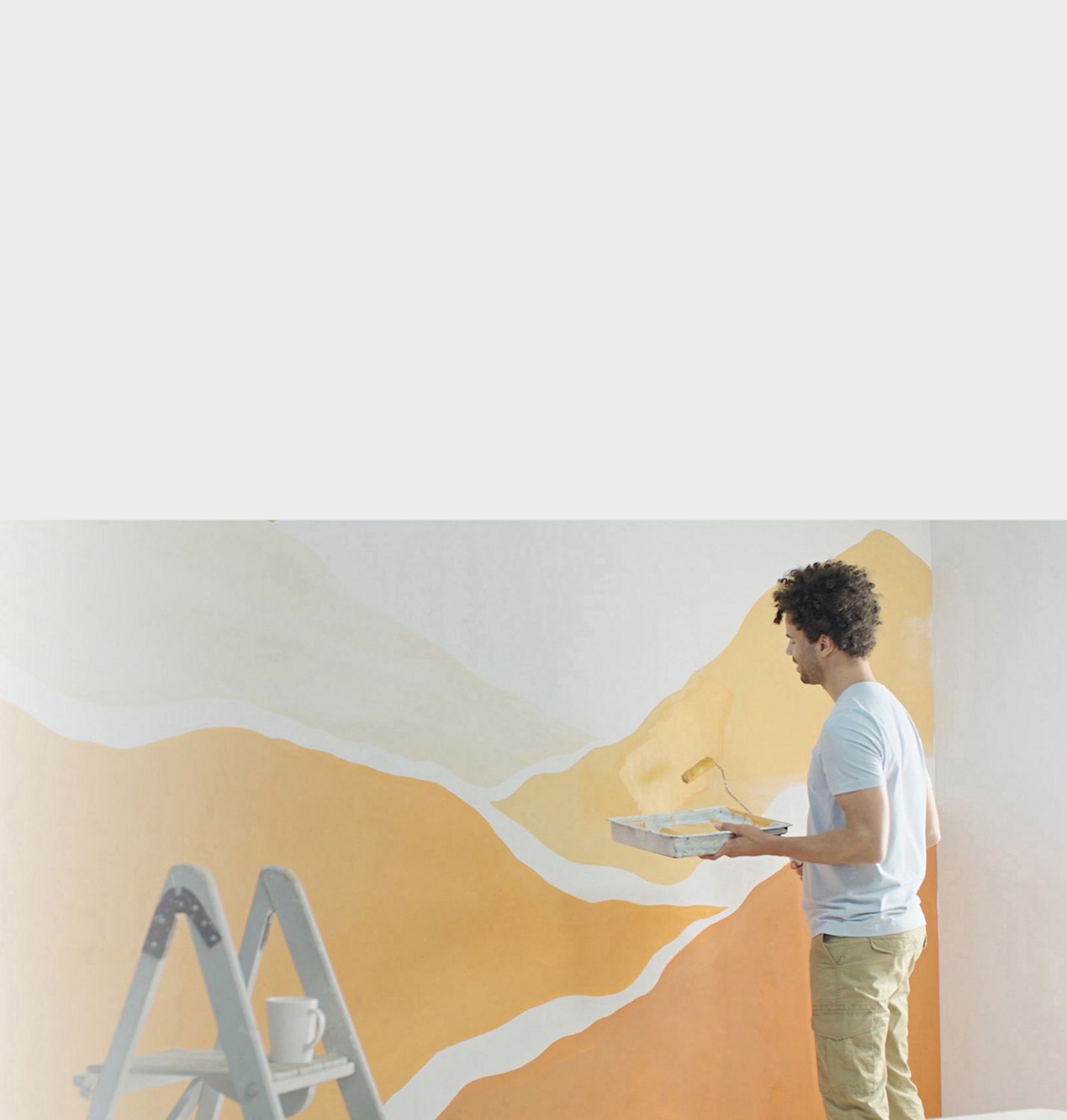 A man painting a wall.