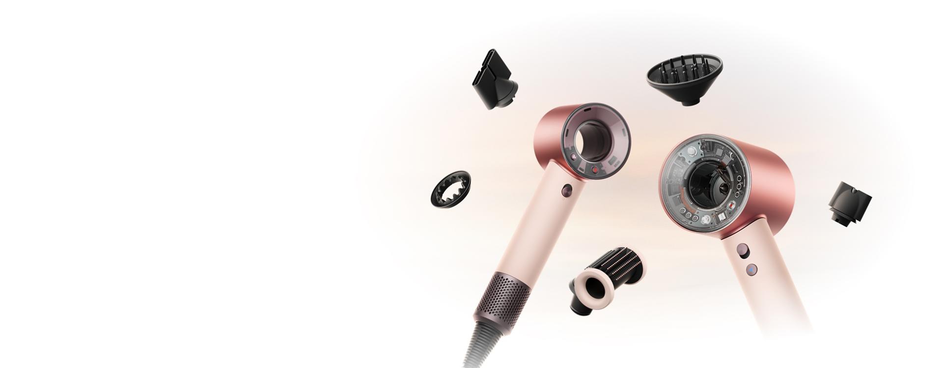 Dyson Supersonic Nural and Travel hair dryers surrounded by attachments.
