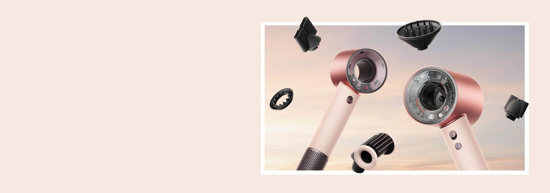 Dyson Supersonic Nural and Travel hair dryers surrounded by attachments.