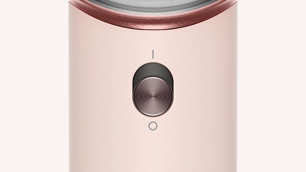 The power button on the Dyson Supersonic Travel hair dryer.