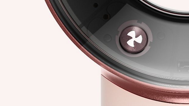 The airflow control button on the Dyson Supersonic Travel hair dryer.