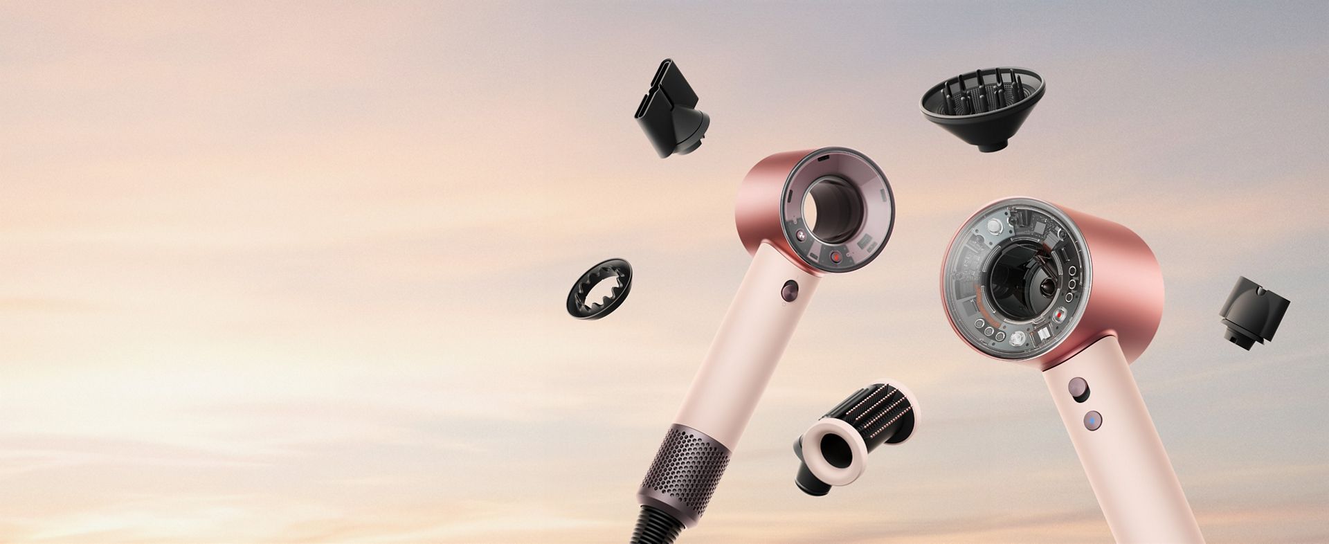 Dyson Supersonic Nural and Travel hair dryers surrounded by attachments.