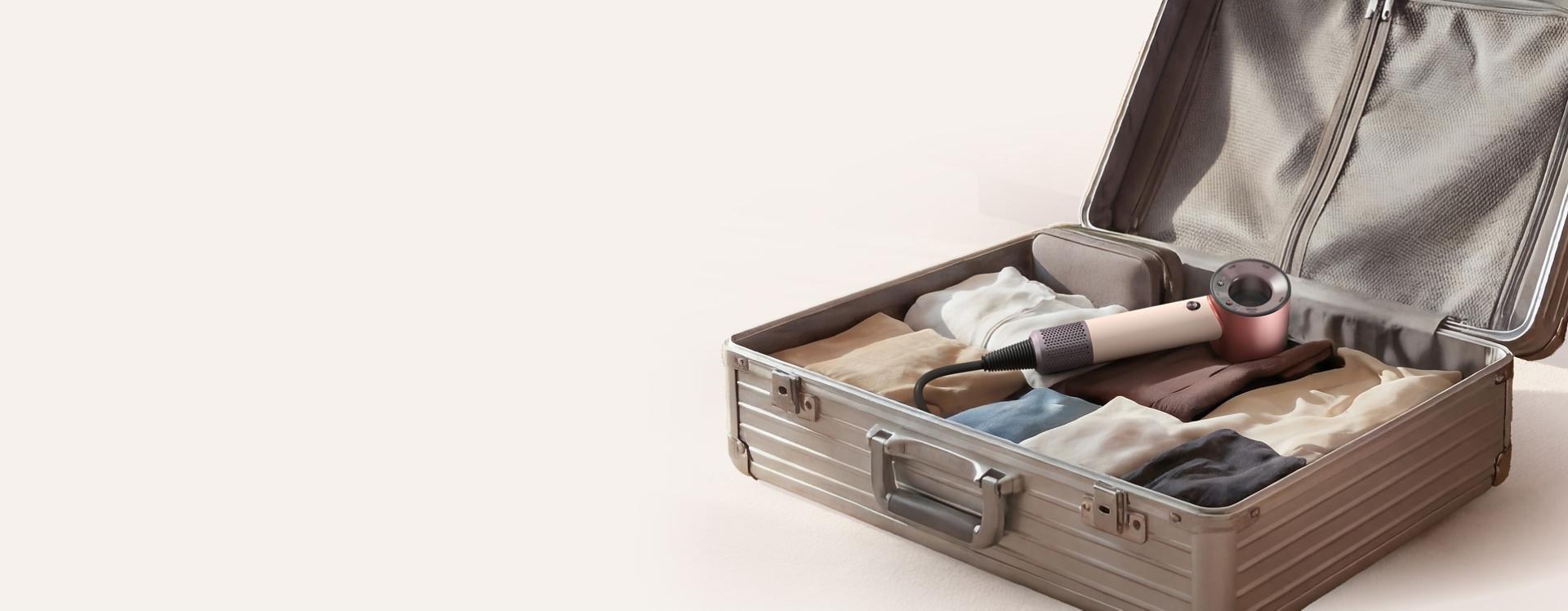 Dyson Supersonic Travel hair dryer in a suitcase.