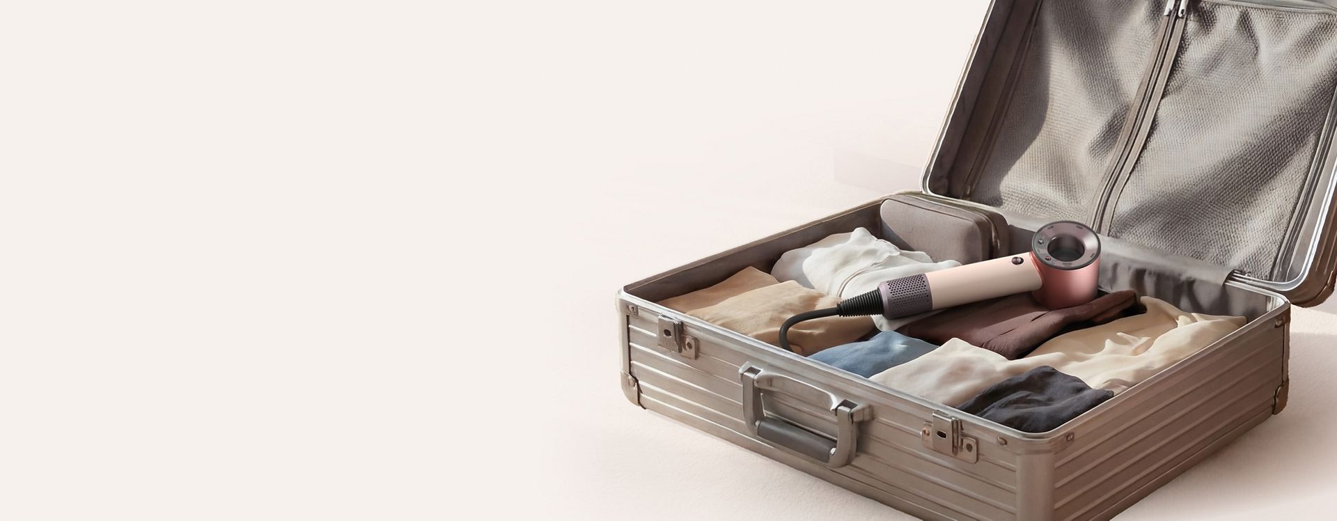 Dyson Supersonic Travel hair dryer in a suitcase.