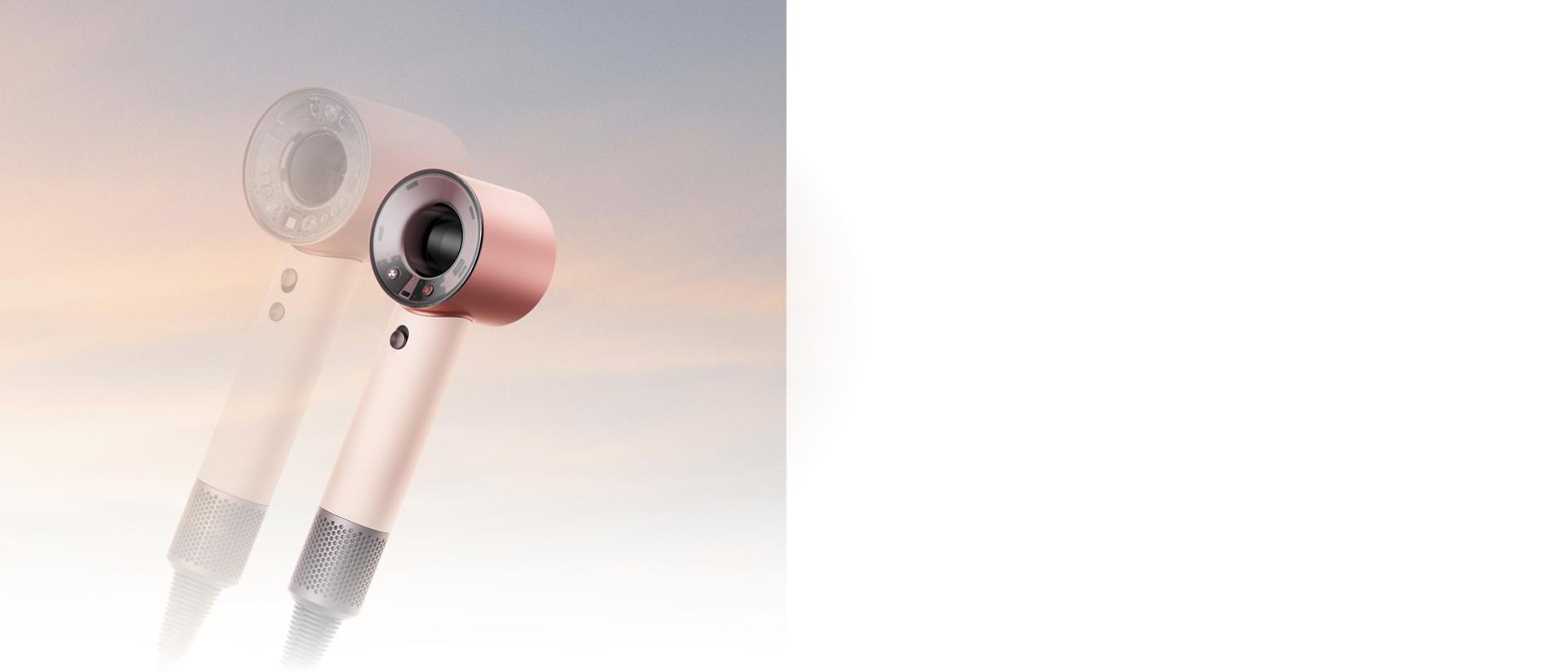 The Dyson Supersonic Travel hair dryer in front of the Dyson Supersonic Nural hair dryer.