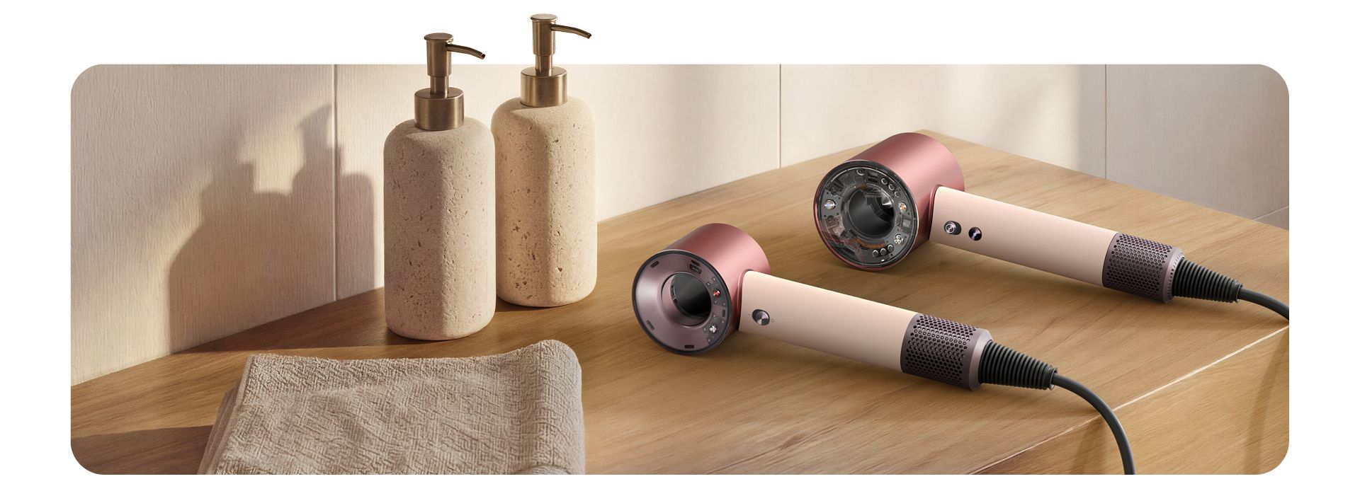 Dyson Supersonic Travel and Nural hair dryers on a bathroom shelf.