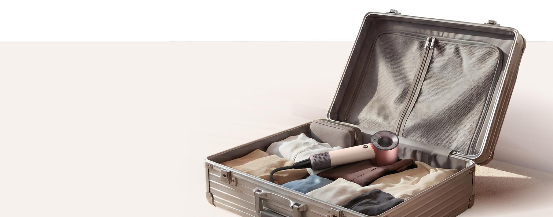 Dyson Supersonic Travel hair dryer in a suitcase.