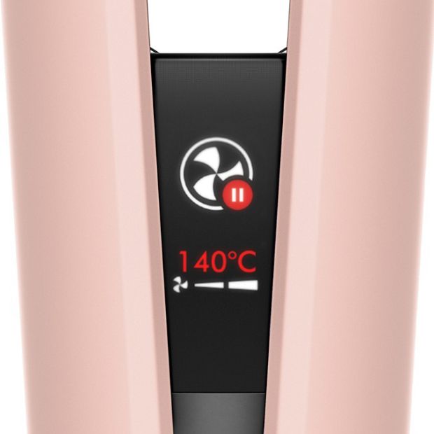 The LCD screen of the Dyson Airstrait straightener shows Auto-pause mode is active.