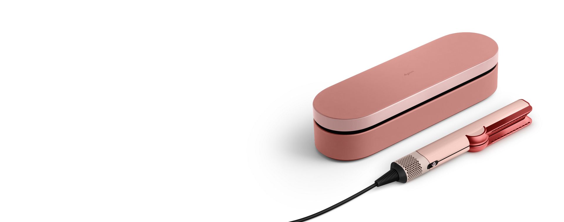 The Dyson Airstrait straightener and Presentation case in the Kanzan pink colourway.