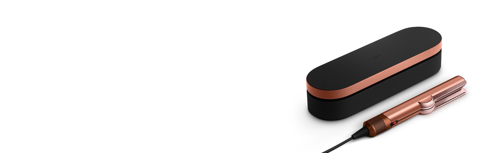 The Dyson Airstrait dryer and straightener with included complimentary gifts.