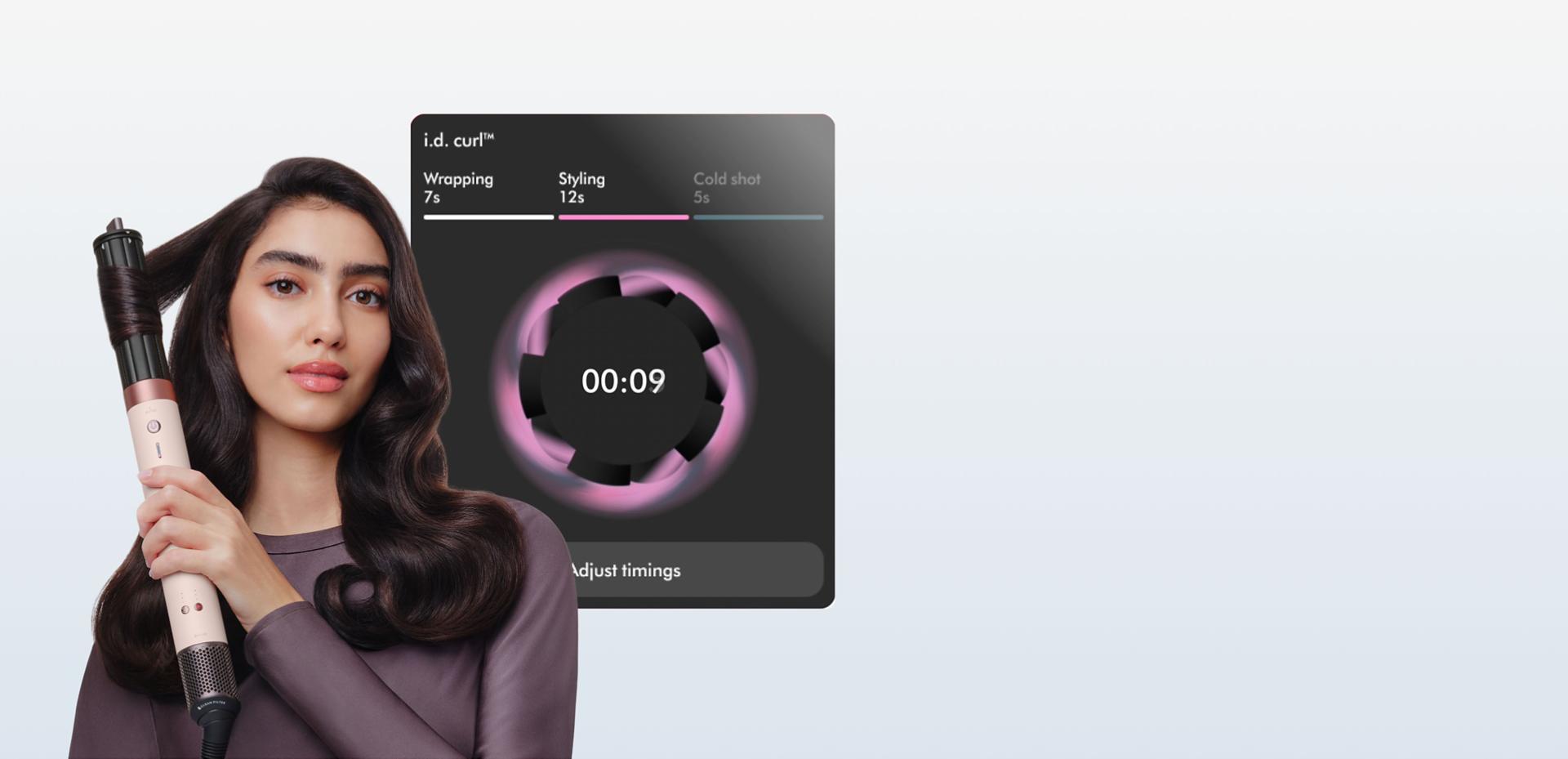 Model curls her hair in front of a screen showing the ID curl personalised curling sequence.