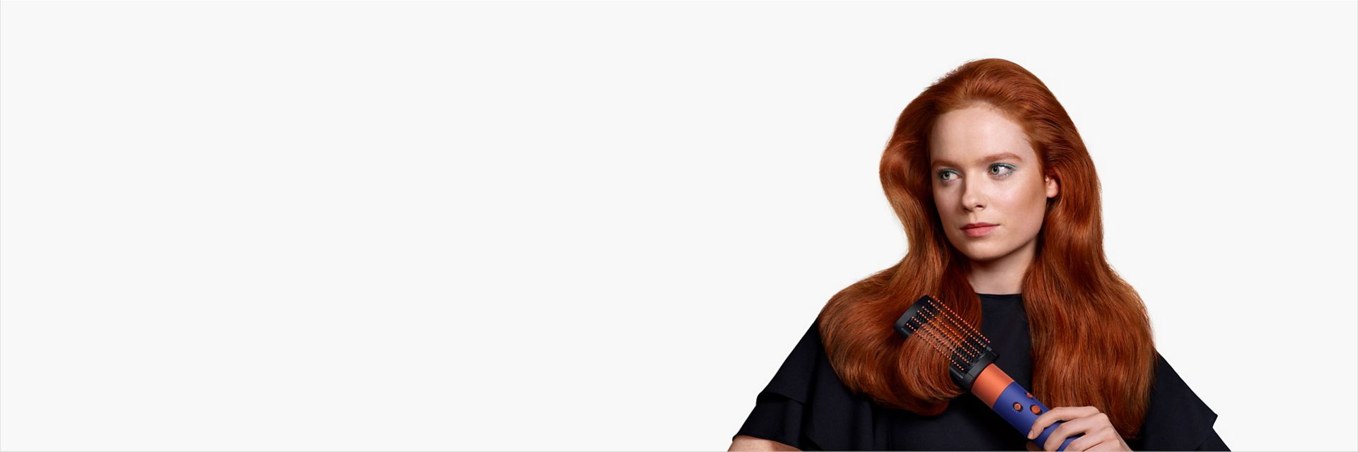 A model with long red hair uses the soft smoothing brush.