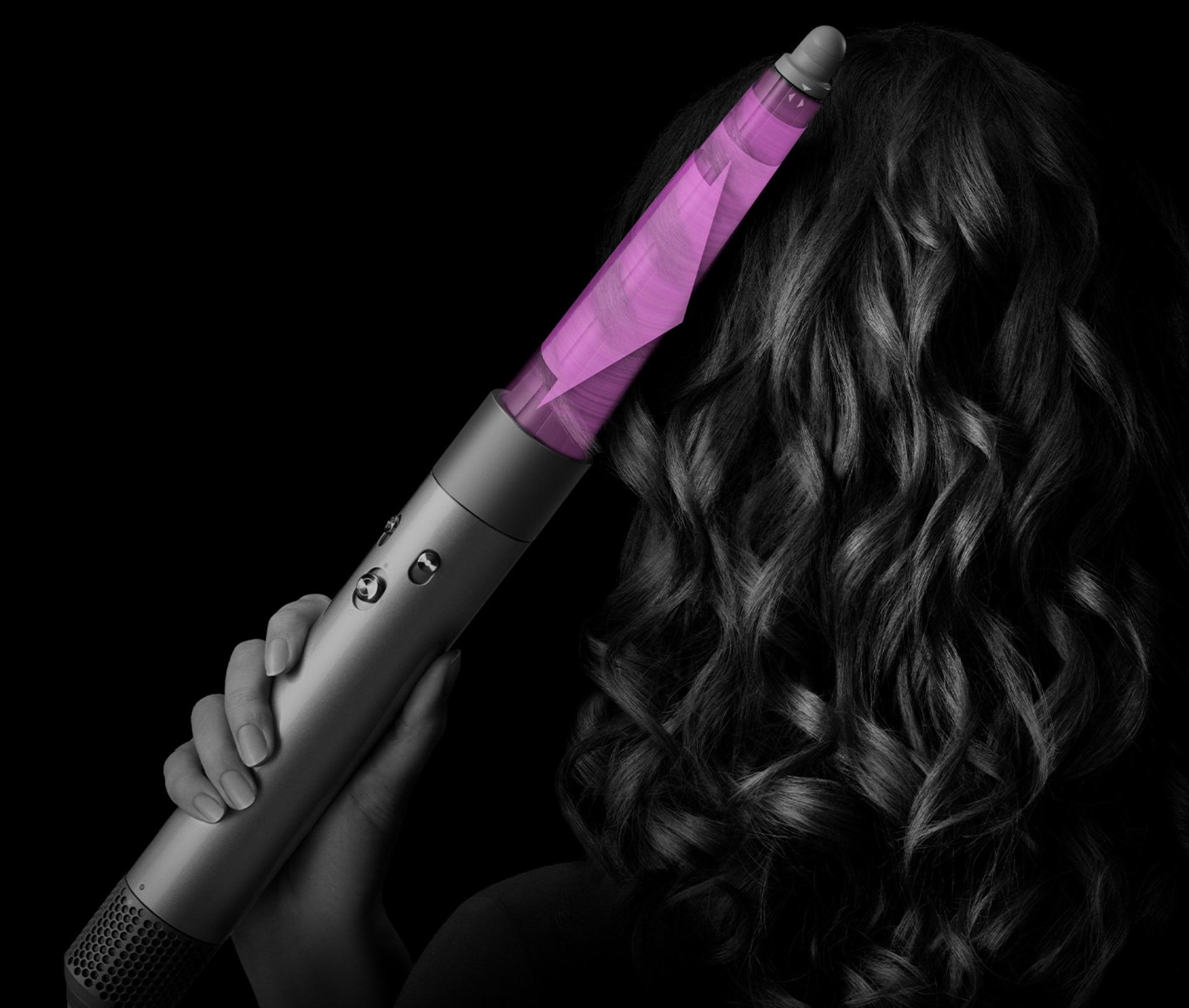 A model uses the Conical Airwrap barrel to style their hair.