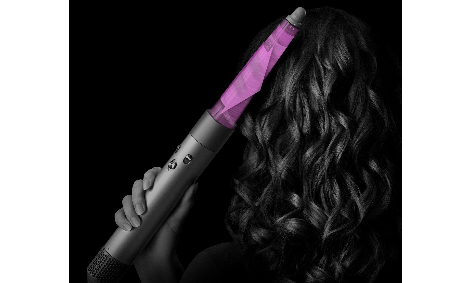 A model uses the Conical Airwrap barrel to style their hair.