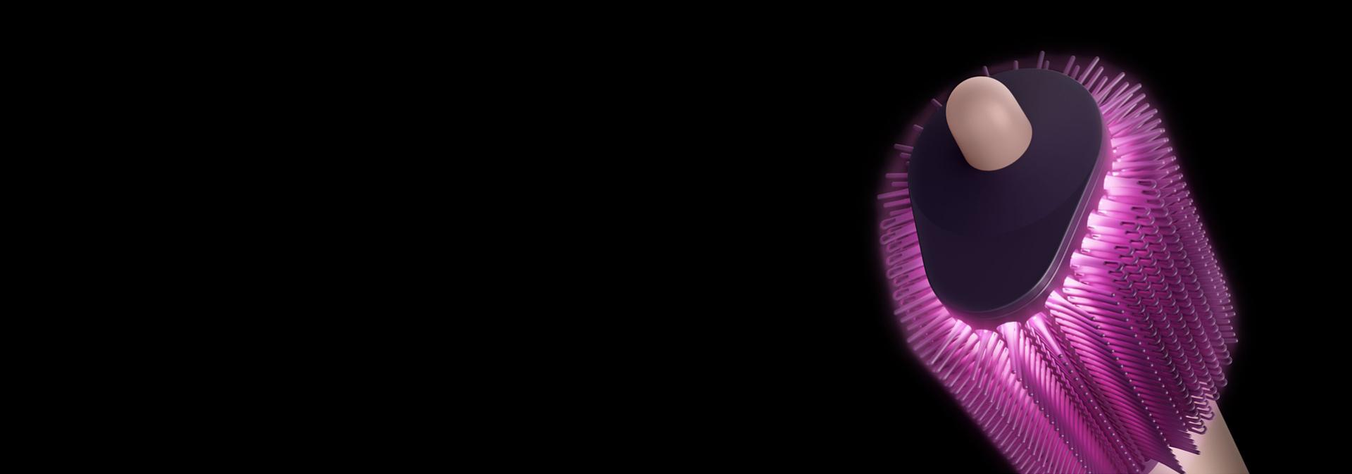 Pink graphics show airflow through the bristles on the Dyson Airsmooth styling brush.