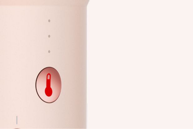 The temperature control button on the Dyson Airsmooth styling brush.