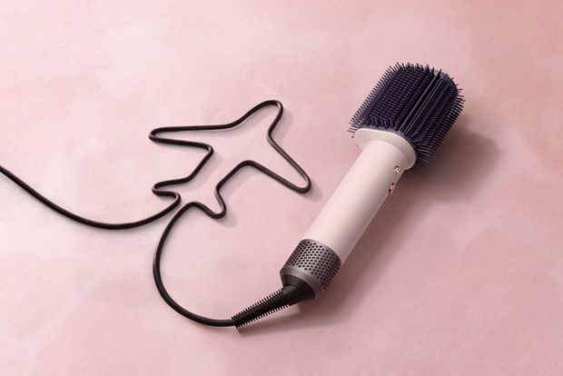 The power button on the Dyson Airsmooth styling brush.