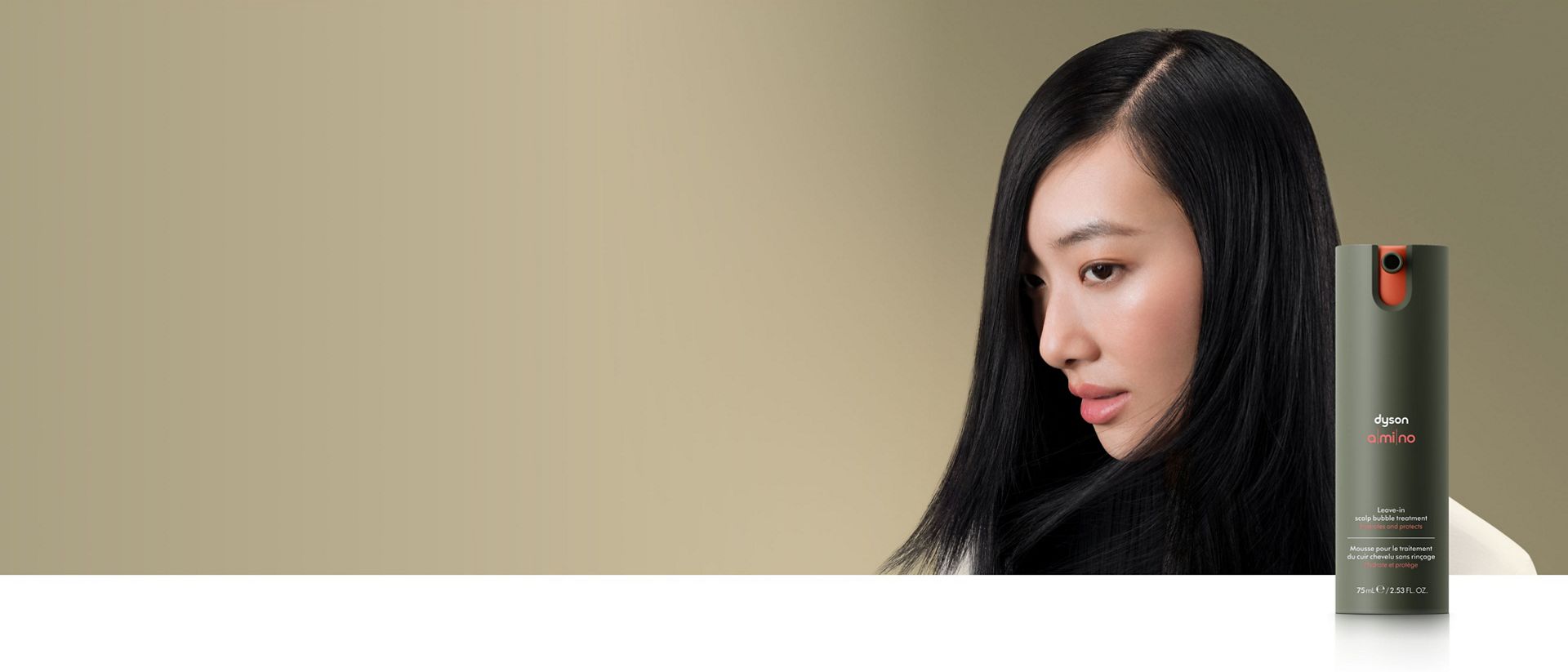 A straight haired model behind the Dyson Amino™ scalp care range. 