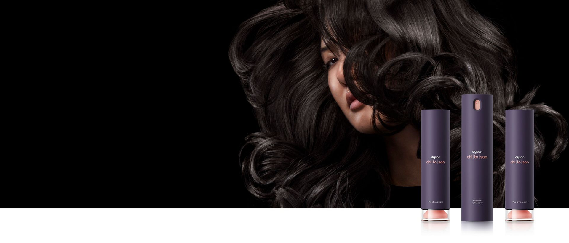 Kosmetyki do stylizacji włosów Dyson Chitosan na tle kobiety z czarnymi włosami.